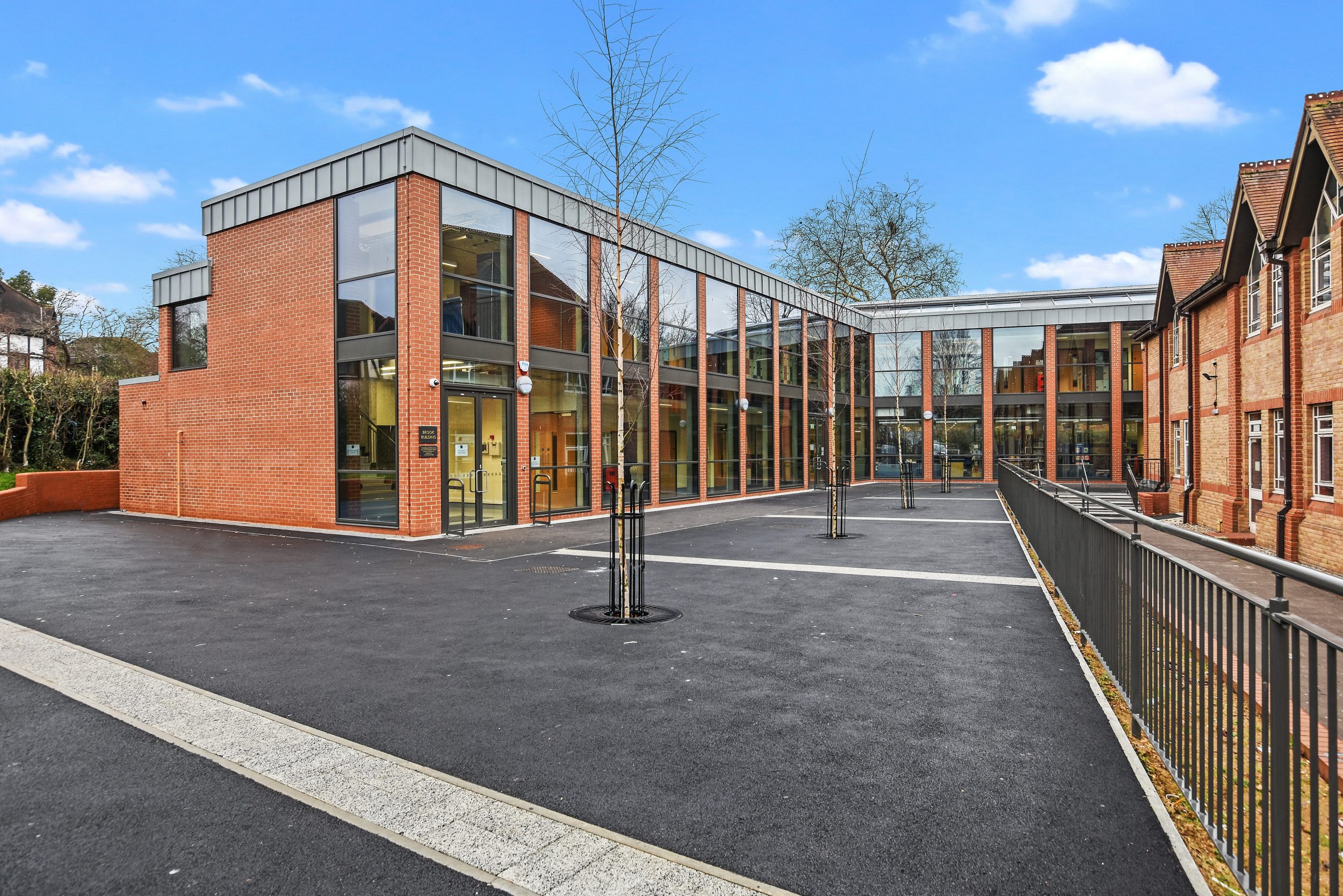 School building and courtyard with some trees
